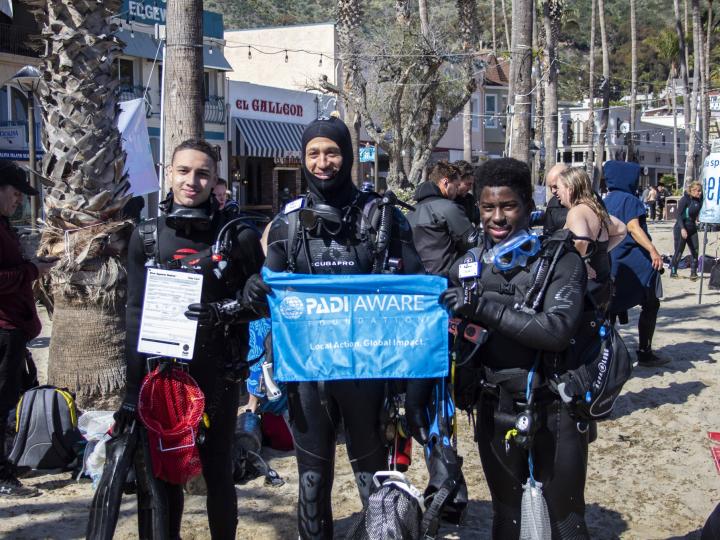 people holding a padi aware sign